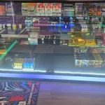 A bustling smoke shop environment displaying an assortment of items, from bongs to cigars and tobacco, arranged for easy browsing.
