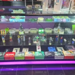 A bustling smoke shop environment displaying an assortment of items, from bongs to cigars and tobacco, arranged for easy browsing.