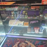 A bustling smoke shop environment displaying an assortment of items, from bongs to cigars and tobacco, arranged for easy browsing.